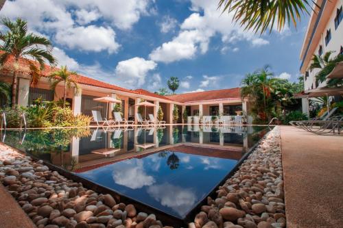 an image of a resort with a swimming pool at LAOTEL VIENTIANE in Vientiane