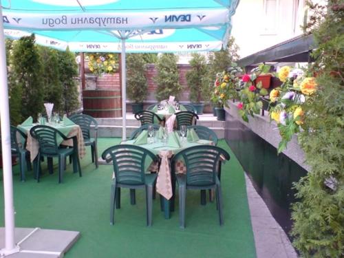 a group of tables and chairs on a patio at Darling Hotel in Sofia