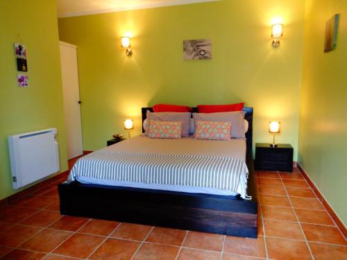 a bedroom with a large bed in a room at Alegria in Arbellara