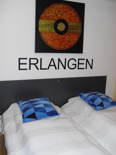 a bedroom with two beds and a sign that sayshaven at Studio A Am Burgberg in Erlangen