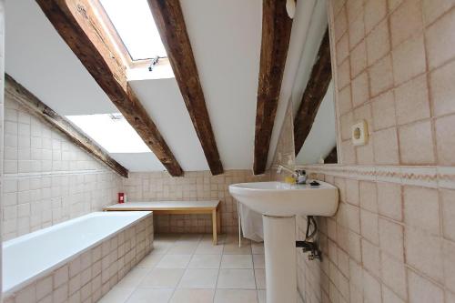 a bathroom with a bath tub and a sink and a bath tub at COZY ROMANTIC MALASAÑA in Madrid