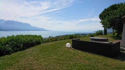a hillside with a view of the water at Sunset House with gorgeous view of the lake in Montreux