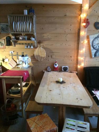 a kitchen with a wooden table in a room at Avoriaz cocooning in Avoriaz