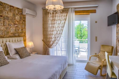 Postel nebo postele na pokoji v ubytování G&K Stone Suites