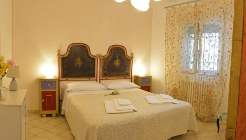 Ένα ή περισσότερα κρεβάτια σε δωμάτιο στο La Villa di Anglani