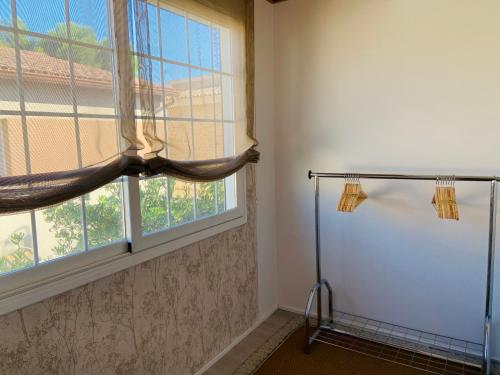 a bathroom with a window and a shower at Casa Cambrils Bahia in Cambrils