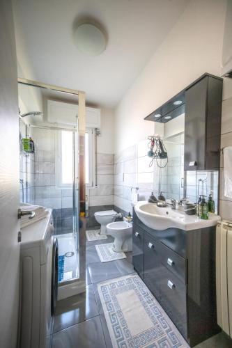 a bathroom with a sink and a toilet at La Nadia in Marghera