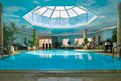 a large swimming pool with a domed ceiling at Four Seasons Hotel Cairo at Nile Plaza in Cairo
