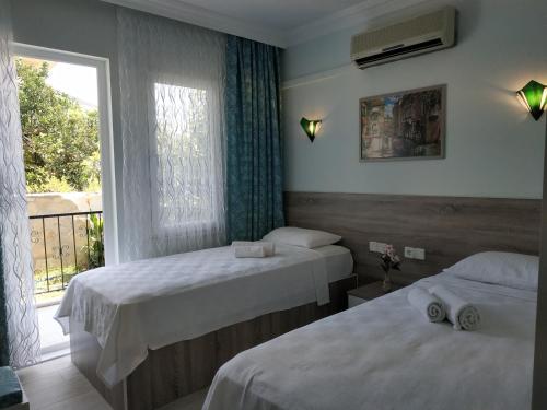Llit o llits en una habitació de Hotel Mico