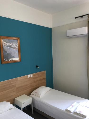 Ein Bett oder Betten in einem Zimmer der Unterkunft Hotel Kastoria