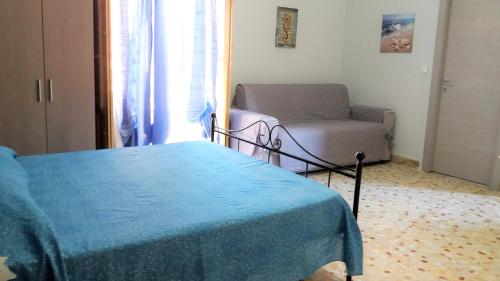 A bed or beds in a room at Casa Vacanza Trappeto Palermo