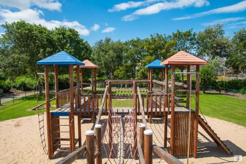 a playground with a slide in a park at Floreal Blankenberge in Blankenberge