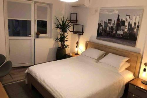 Postel nebo postele na pokoji v ubytování Downtown chic