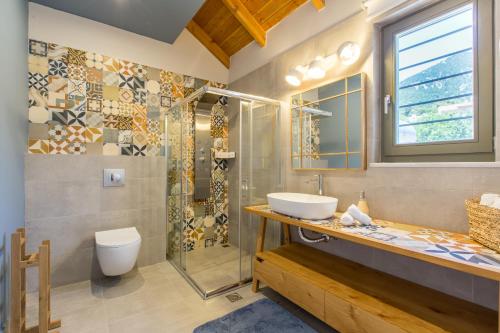 a bathroom with a sink and a shower at Villa Skyphos in Ammoudari