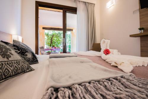 Ένα ή περισσότερα κρεβάτια σε δωμάτιο στο Relais del Borgo- Domo