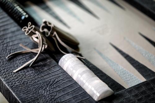 a pair of scissors sitting on top of a table at Maison d'hôtes & SPA La Scierie in Salins-les-Bains