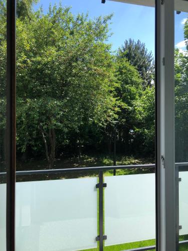 a window with a view of a tennis court at Apartamenty Pod Gwiazdami in Ustroń