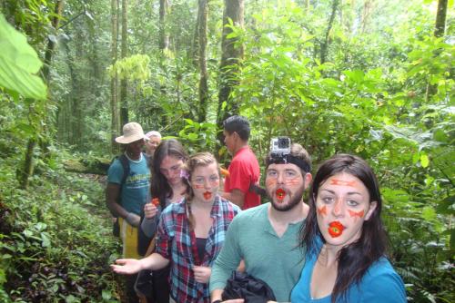 a group of people walking in the woods at Finca de la Vaca - Family House in Mera