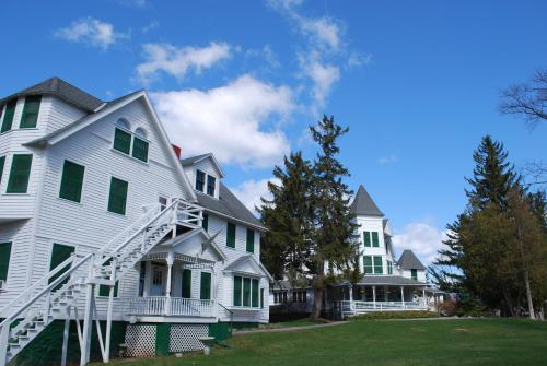 a group of white houses with green shutters at Anne's Washington Inn in Saratoga Springs