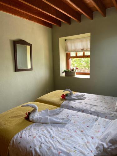 Tempat tidur dalam kamar di CASAS RURALES TIO ANTONIO