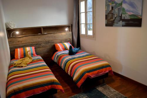 Postel nebo postele na pokoji v ubytování Matin d'été