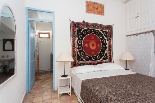 Posteľ alebo postele v izbe v ubytovaní L'Agave, Salina