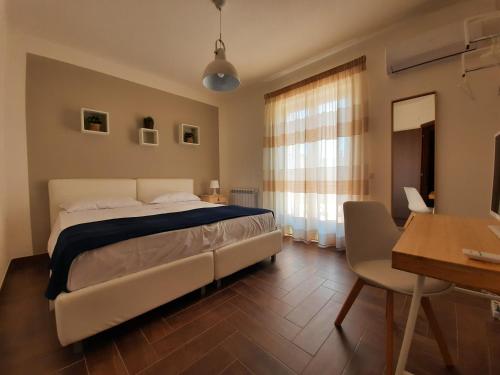 A bed or beds in a room at Il Borghetto di San Giuseppe EtnaRooms&Apartments