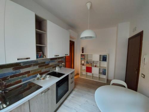 a kitchen with a sink and a counter top at Isabella d'Aragona Guest House in Barletta