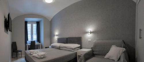 En eller flere senge i et værelse på Beatus Viator Guest House