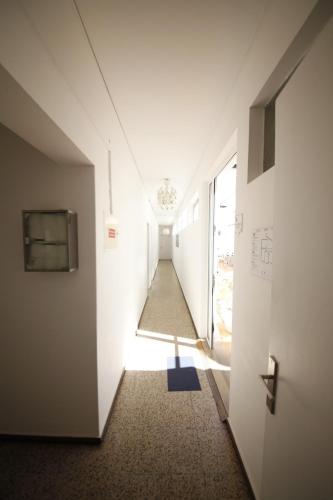 a hallway with a door leading to a hallway at The Story Guest House in Faro