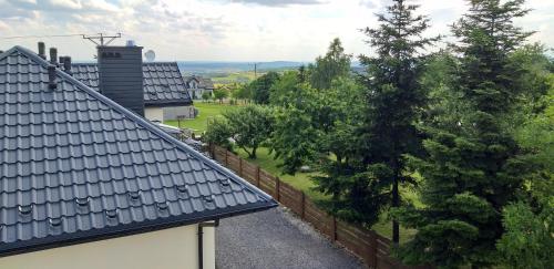 a view from the roof of a house with trees at Noclegi u Banysia w sercu Gór Świętokrzyskich in Krajno Pierwsze
