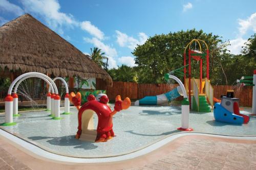 a childrens playground with a water park at Dreams Sapphire Resort & Spa in Puerto Morelos