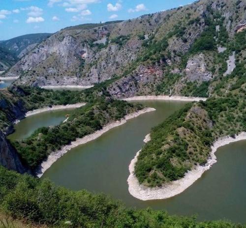 an aerial view of a river in a mountain at Vila Medo in Brdo