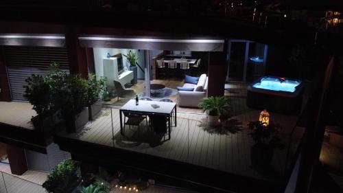 an aerial view of a living room at night at The Q Superior - a penthouse with jacuzzi and sauna in Rovinj