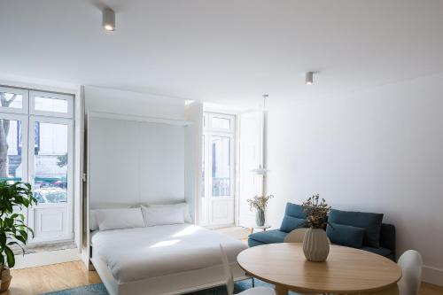 a living room with a couch and a table at São Vicente 1797 Apartments in Lisbon