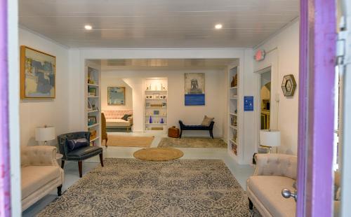 a living room with a couch and chairs and a table at Narragansett House in Oak Bluffs