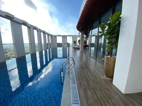 a swimming pool on the top of a building at Muong Thanh Luxury Saigon Hotel in Ho Chi Minh City