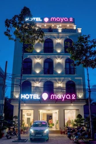 a hotel with a car parked in front of it at Maya Hotel 2 in Con Dao