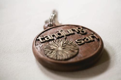 a brown pocket watch with the words kennlins at Tandjung Sari Hotel in Sanur