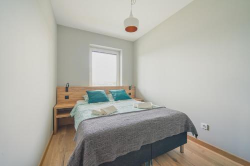 Ένα ή περισσότερα κρεβάτια σε δωμάτιο στο Apartamenty SZAROTKA Nowy Targ