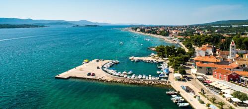 an aerial view of a harbor in a body of water at Villa Marija in Sveti Filip i Jakov