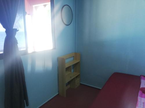 Un ou plusieurs lits dans un hébergement de l'établissement Permata Beach Chalet