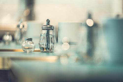 a glass jar sitting on top of a counter at Hotel Bernina Geneva in Geneva