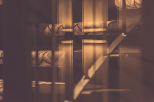 a reflection of a table and chairs in a room at Hotel Bernina Geneva in Geneva
