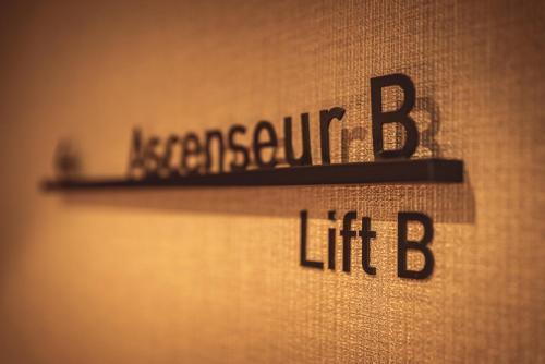 a sign with the wordsassociation b lift on a wall at Hotel Bernina Geneva in Geneva