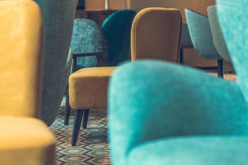 a row of seats on a bus at Hotel Bernina Geneva in Geneva
