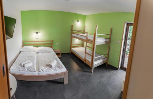 Postel nebo postele na pokoji v ubytování Penzion TOPAS