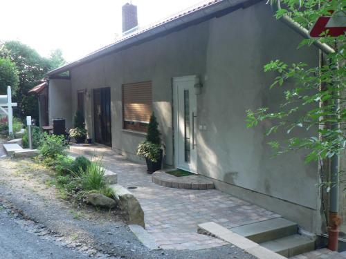 a side of a house with a brick walkway at Brands Appartement in Ober-Nauses