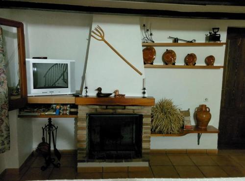 デルテブレにあるCaseta Manigotxaのリビングルーム(テレビ、暖炉付)