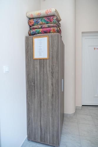 a large wooden box with a sign on it in a room at Elena Apart in Keszthely
